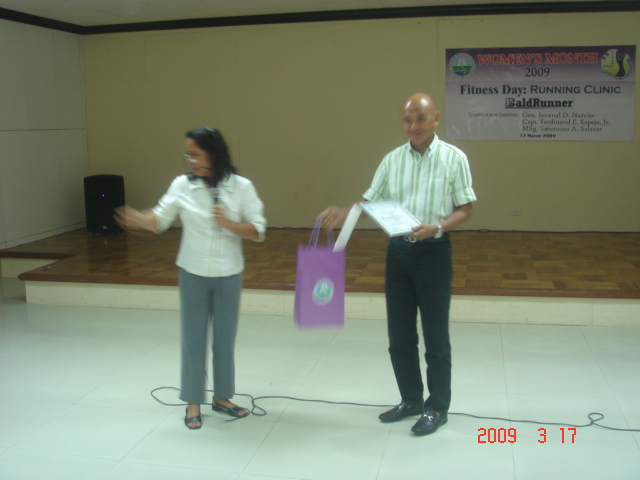 Receiving a Certificate Of Appreciation & Loot Bag