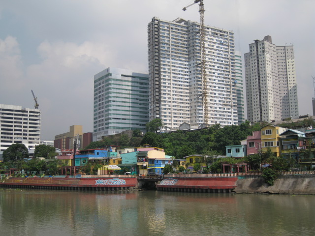 What is the difference living in a Gawad Kalinga Community and in a High-Rise Condo along the Pasig River?