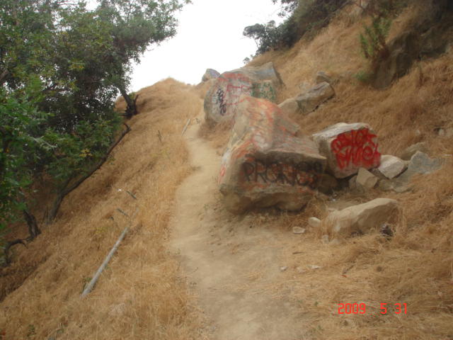 Graffitis On Rocks Along The Single Track Trail