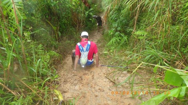 Runner Falling On His Butt To The Ground Due To Muddy & Slippery Trail 